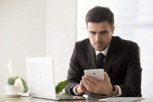 male business leader browsing online resources using gadgets 1163 5340