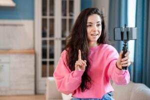 young blogger using selfie stick talking phone 23 2148538871